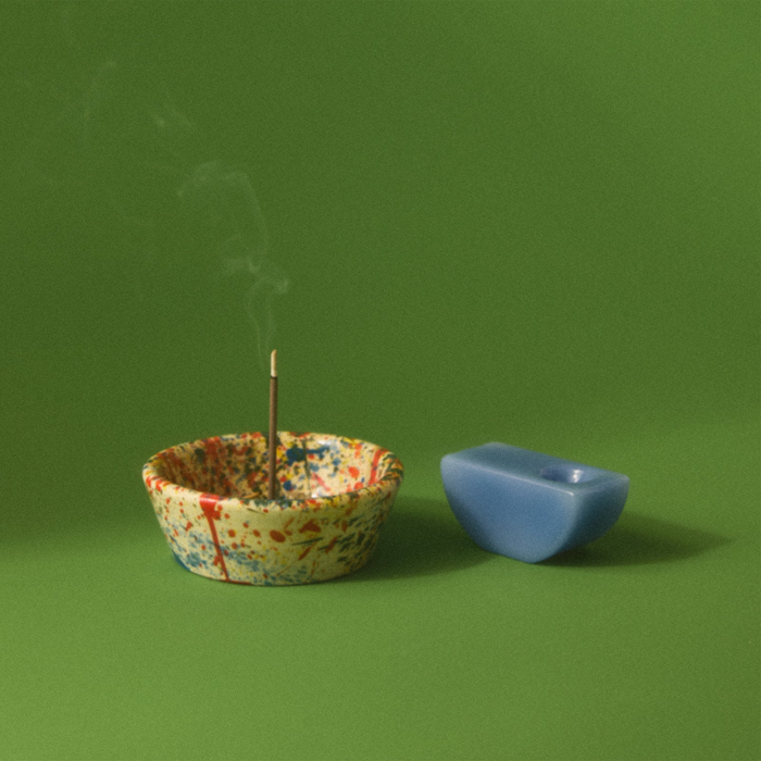Styled photo of well designed smoking accessories. Grinder, matches, stash jar, rolling papers, ashtray. cbd wnc